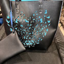 Ladies black and blue gorgeous leather bag with unique cut-out detailing with matching wallet