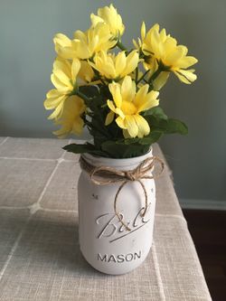 Distressed mason jar vase with silk flowers