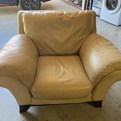Cream Colored Leather Lounge Chair.