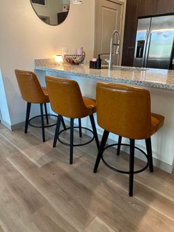 Three Matching Swivel Barstools
