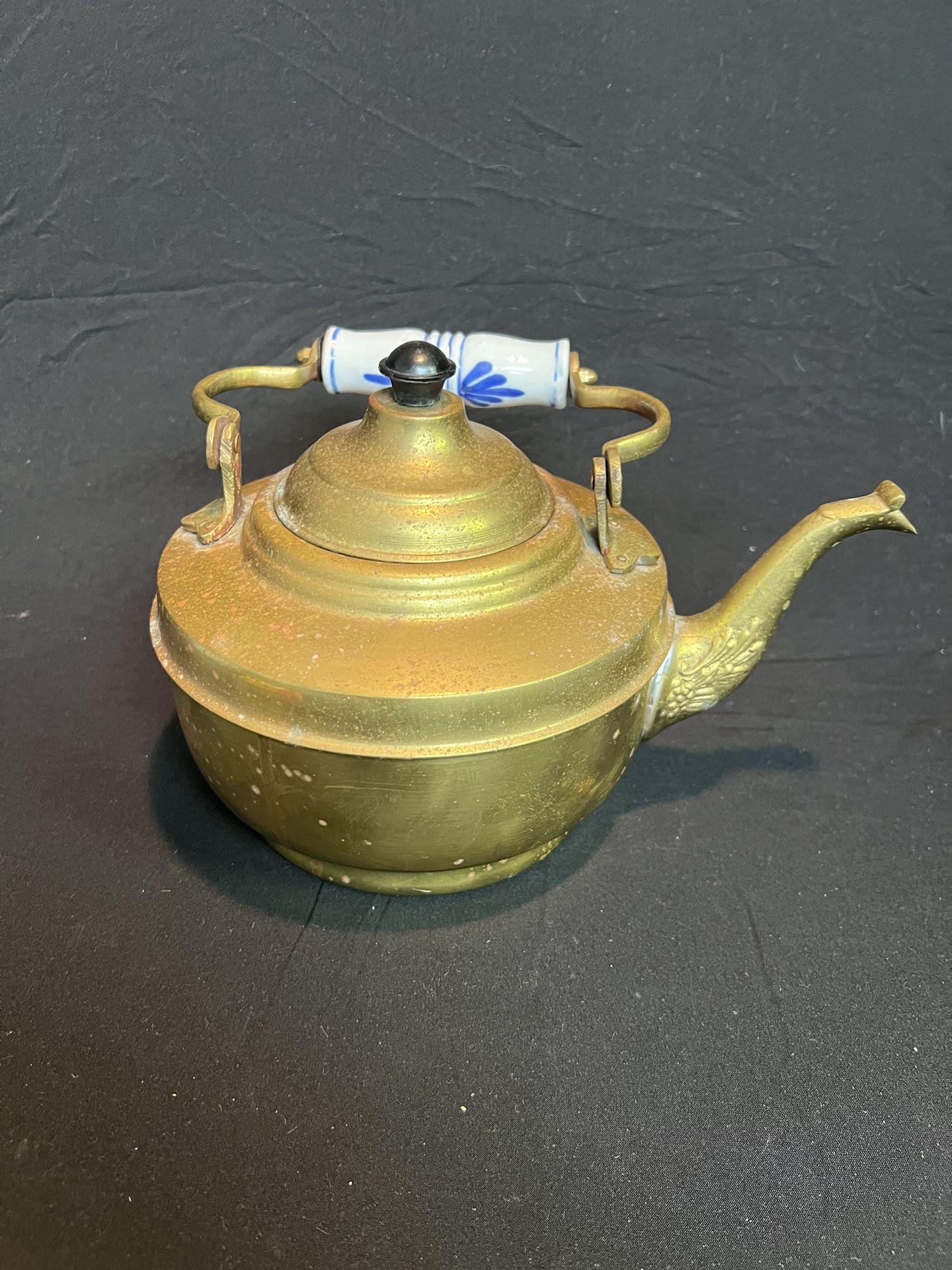 Copper tea kettle with blue and white porcelain handles