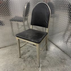 Vintage industrial mid century modern brushed aluminum office side chair located near the Miami Design District