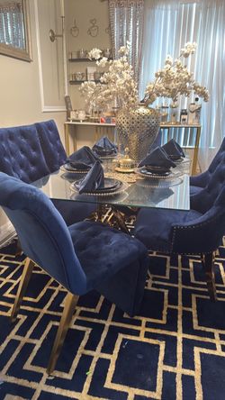 Glass Dining room table with gold stand 6 velvet blue chairs with gold legs