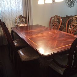 Walnut color table w 6 chairs and china cabinet.