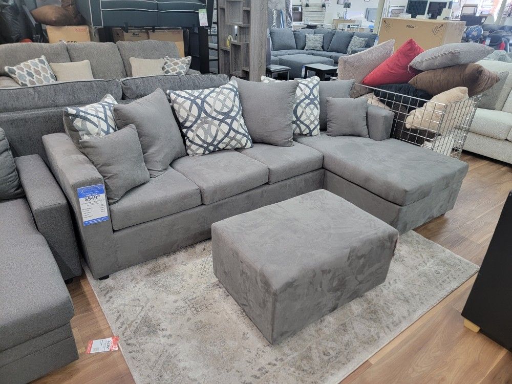 New 2pc Sectional In Grey  Ottoman Included