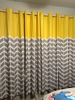 Intelligent Design 2-Pack of Chevron Printed Yellow, White and Gray Darkening Curtains 52x84”.