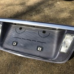 Acura TL trunk lid light / tag plate mount