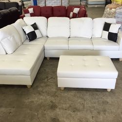 New White Leather Sectional Sofa With Storage Ottoman And Pillows 