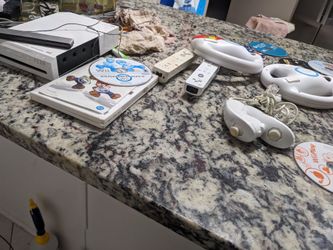 Wii console 10 games 2 racing Mario kart game wheels nunchucks 2 controllers