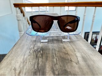 Oakley sunglasses with brown tortoiseshell frames and dark brown lenses