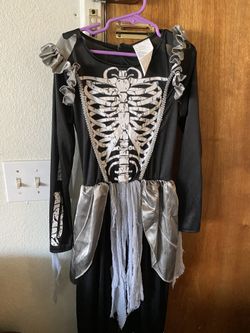 Girls size 8-10 costume worn once. Skeleton And Rock Star