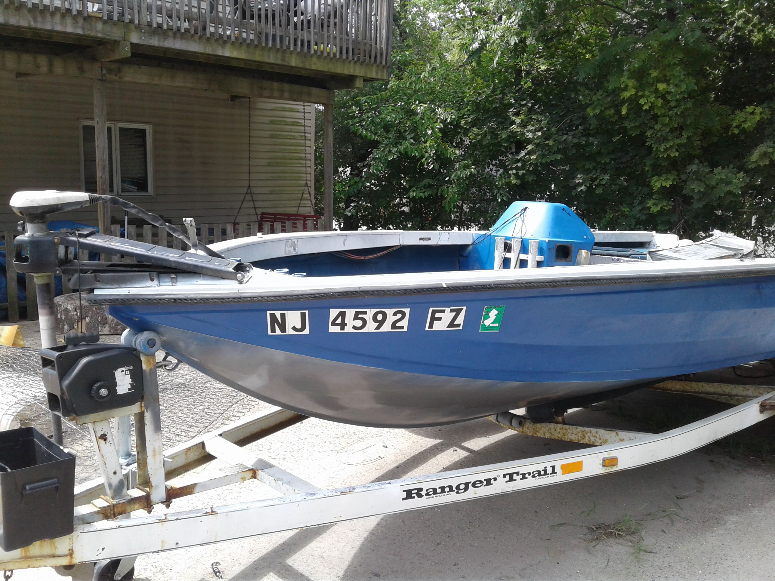 16 ft aluminum Ranger Boat and trailer inside needs to be redone Great project have title for boat and trailer