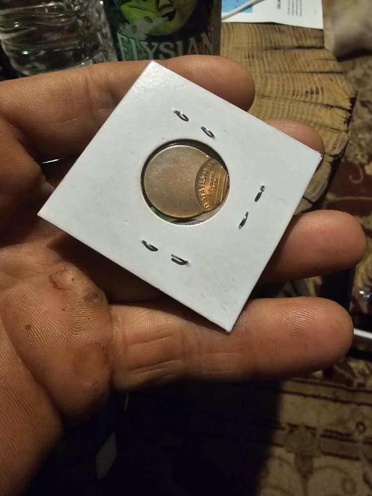 Off center strike penny