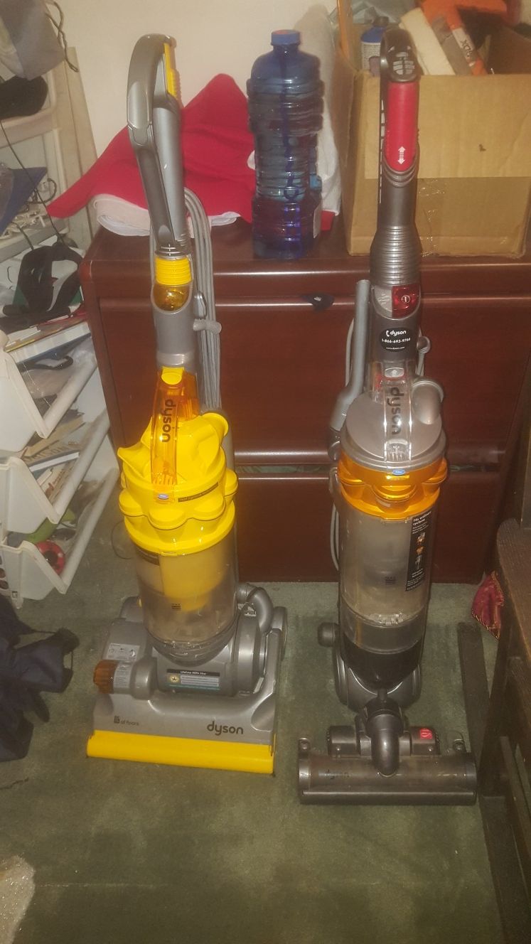 2 Dyson Vacuums