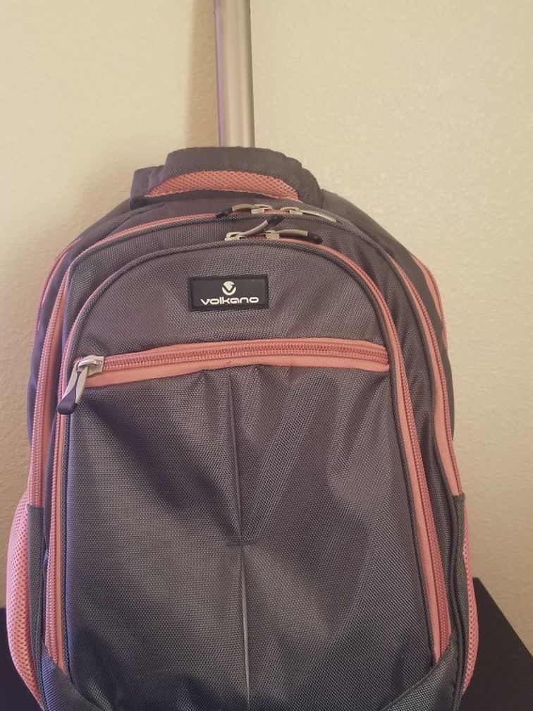 Pink And Grey Rolling Backpack With Computer Pouch