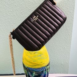 Coach wristlet with linear quilting