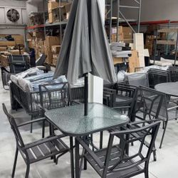 Brand new 6 pieces outdoor patio set with 4 chairs and one glass table and one umbrella 