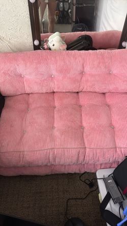 Pink fold out couch