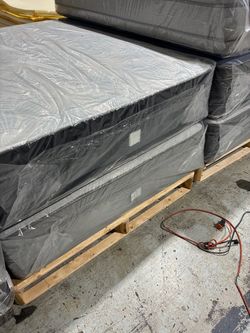 King pillowtop mattress and box spring. New in plastic Free delivery in Atlanta!