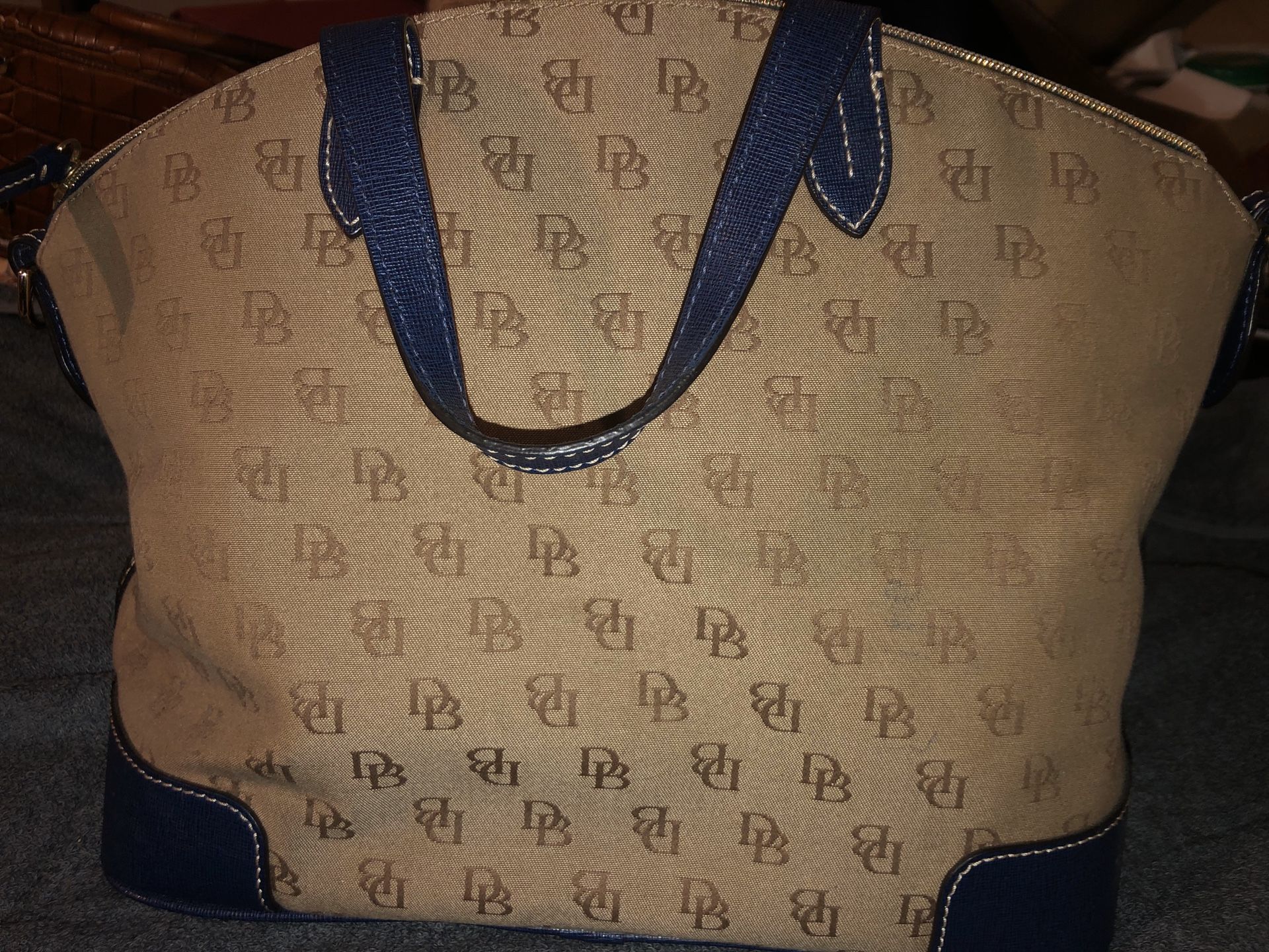 Dooney & Bourke domes satchel brown and blue.  No strap.