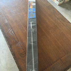 Truck bed ratcheting cargo bar