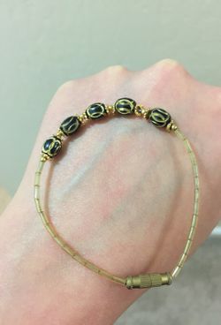Black eyed golden bead bracelet and matching earrings
