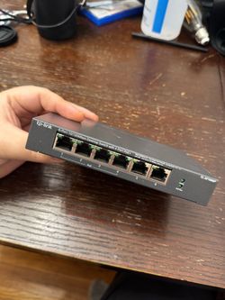 TP-Link TL-SF1006P 6-Port Fast Ethernet PoE+ Switch.
