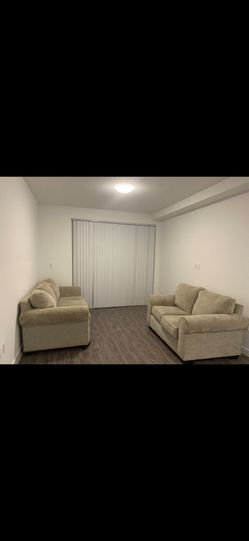 Two Beige Sofas