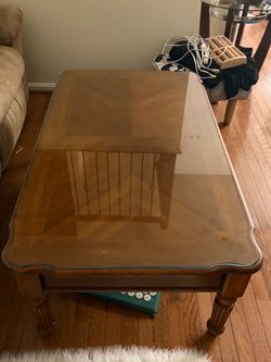 Living room wood table with glass top