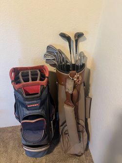 2 golf bags and clubs