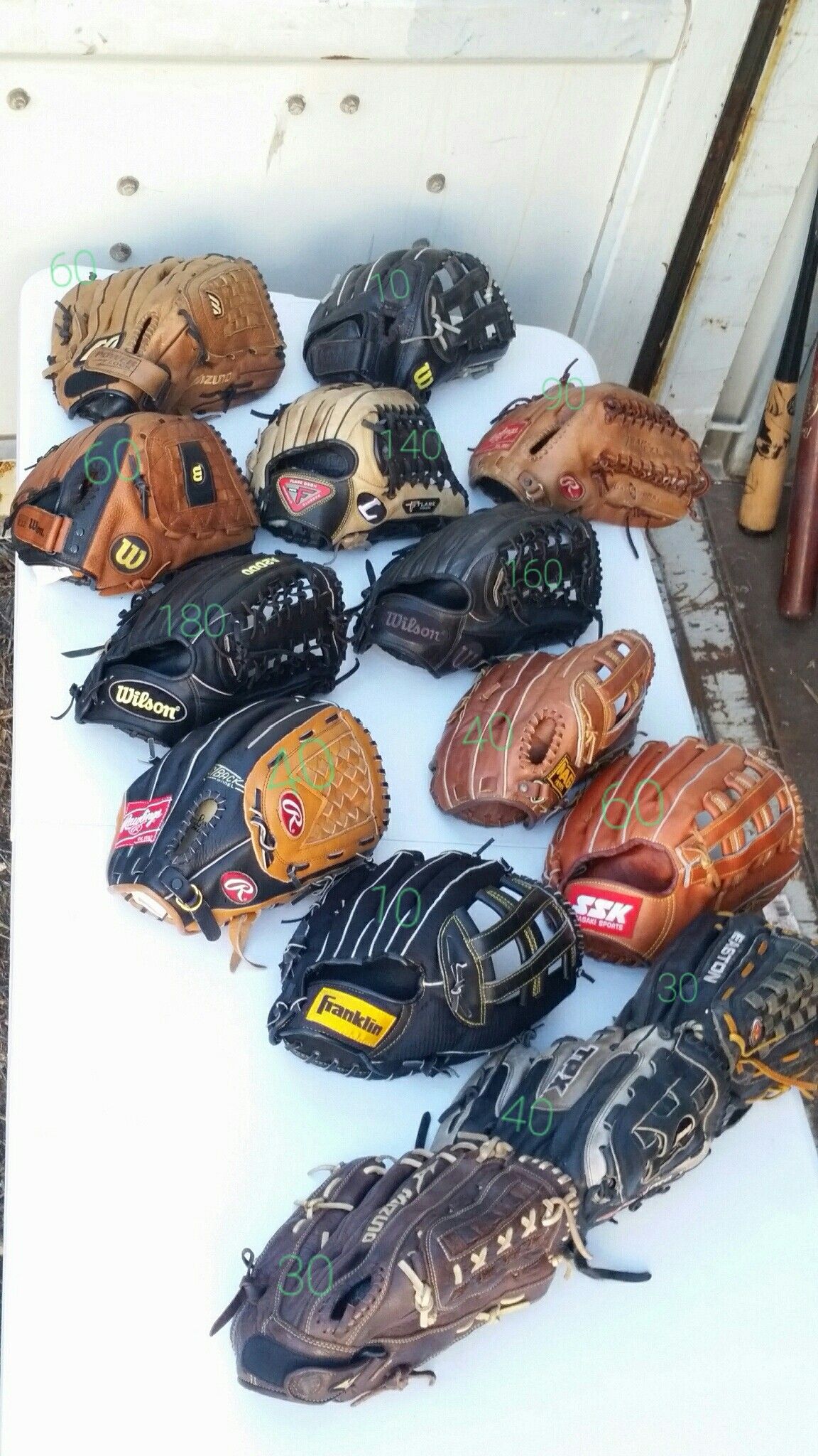 Outfield baseball and softball gloves . Prices as marked