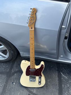 Squire by Fender Tele. Super fun guitar.