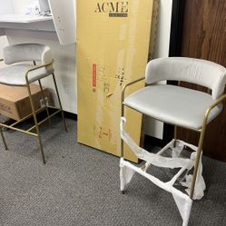 Set of two bar stools with gold frame and Light Gray seat.