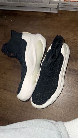 Size 10.5 men’s White and Black EQLZ Basketball shoes