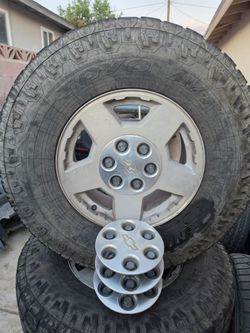 CHEVY SILVERADO STOCK RIMS AND TIRES