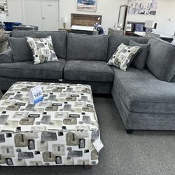 Sectional With Patterned Toss Cushions And Matching Ottoman On Promotion