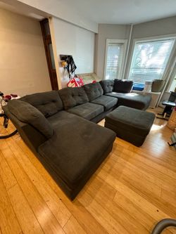 Large Dark Gray Sectional Couch with Pull-Out Sleeper