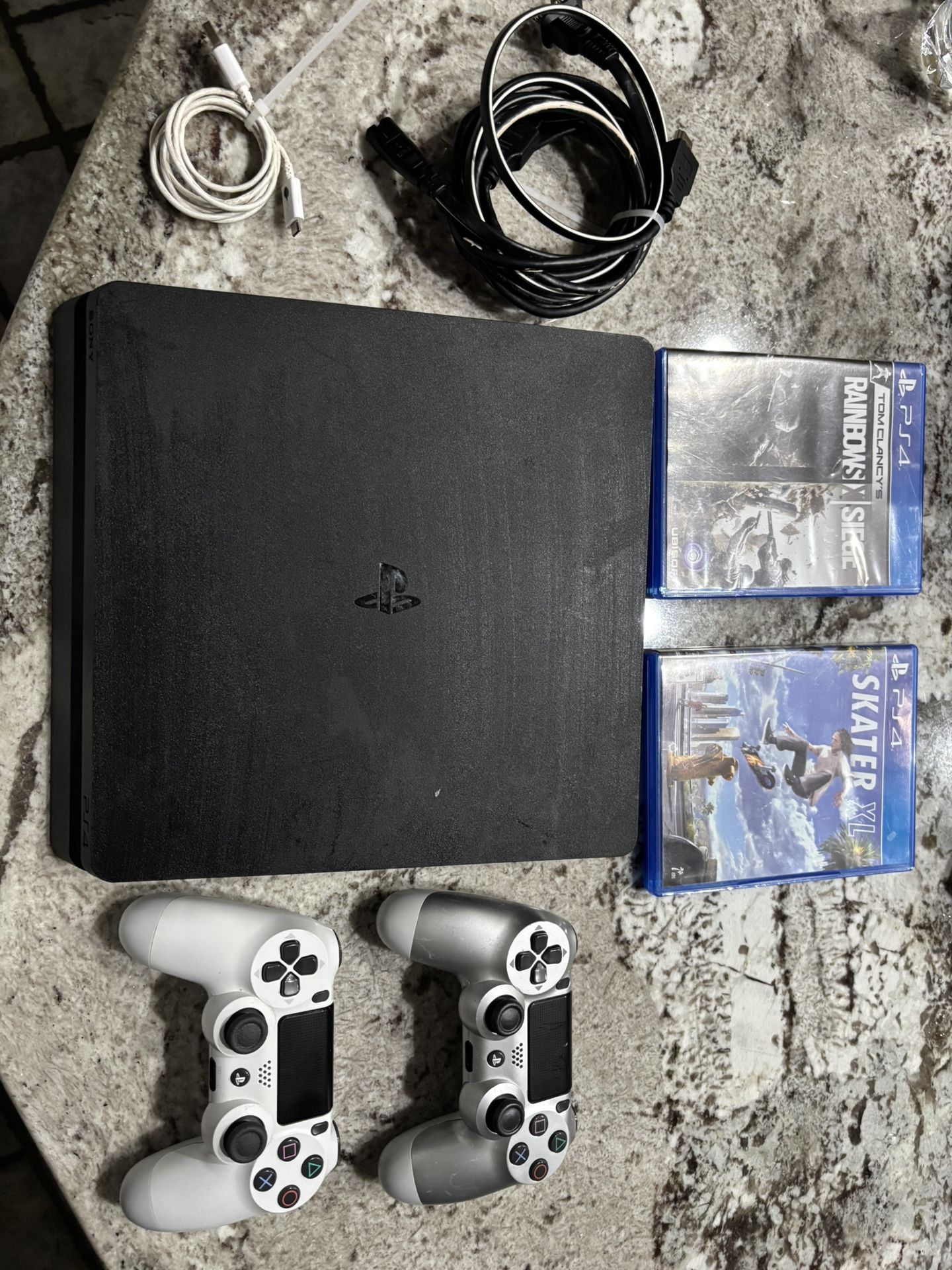 PS4 Bundle – 2 Controllers, 2 Games (Rainbow Six Siege & Skater XL), Charging Cable, All Wires Included