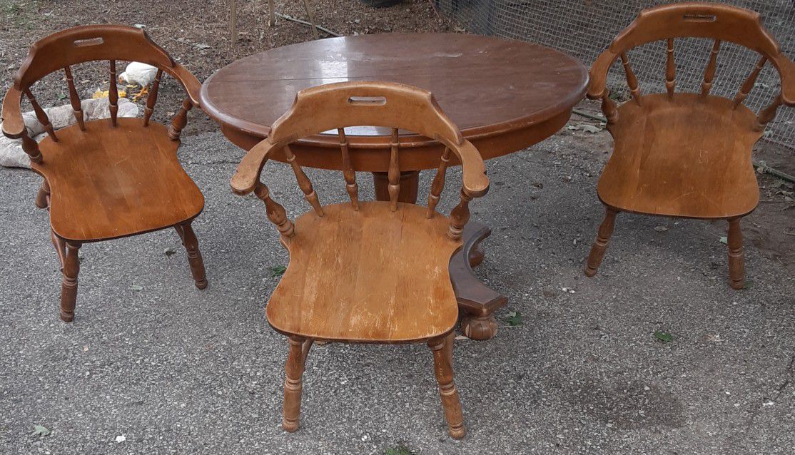 4 chairs and dining table... fourth chair not shown in the picture because two cracks in the seat and needs to be glued. Asking $100.
