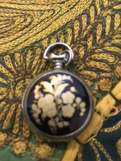 Black n gold pendant watch