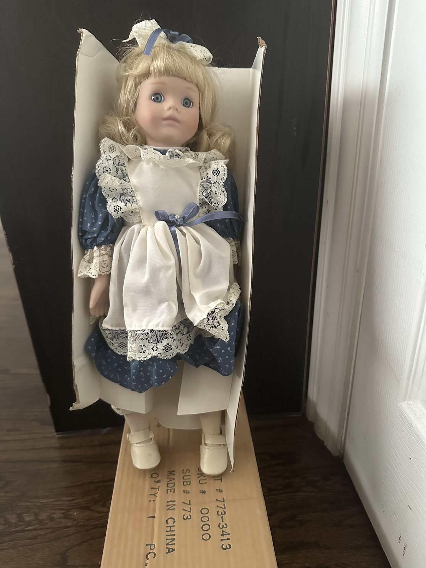 Likely: Dynasty Doll Collection Porcelain Doll