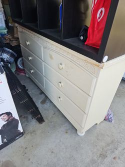 dresser and black shelf