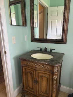 Ornate Wood Bathroom Vanity with Marble Top