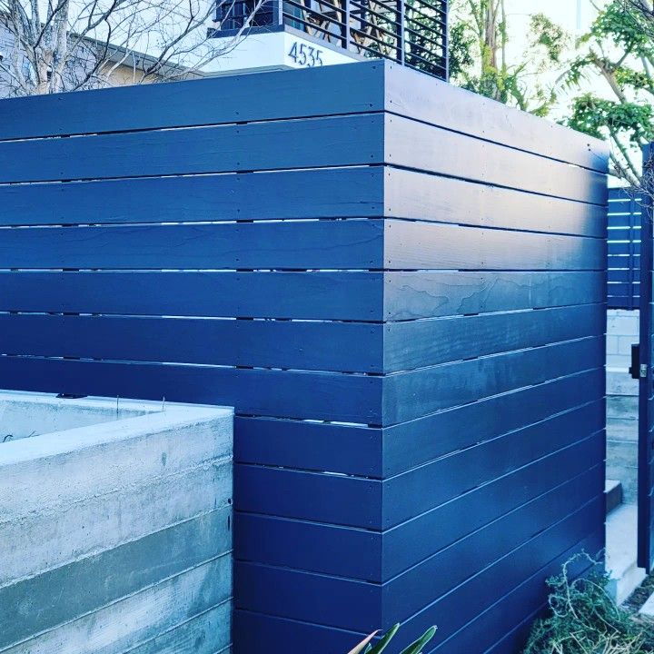 Wood Fence With Metal Frame.