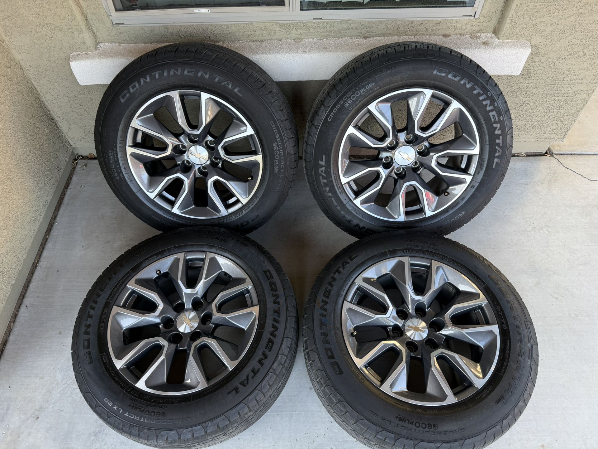 Set of 20-inch wheels with original 2023 Silverado tires in excellent condition.