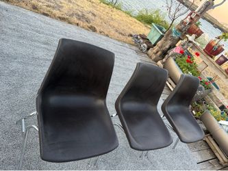 3 plastic chairs with metal legs