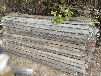 5 Rolls Of Chain Link Fence…6 Feet Tall Approximately 10 And 12 Feet Wide