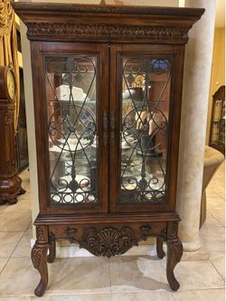 Price: $500 OBO for BOTH  Beautiful matching pair of large ornate wood and glass china/display cabinets. Elegant traditional design with arched tops, 