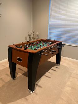 Foosball Table with Red and Blue Players
