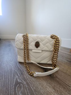 White purse with adjustable gold chain strap